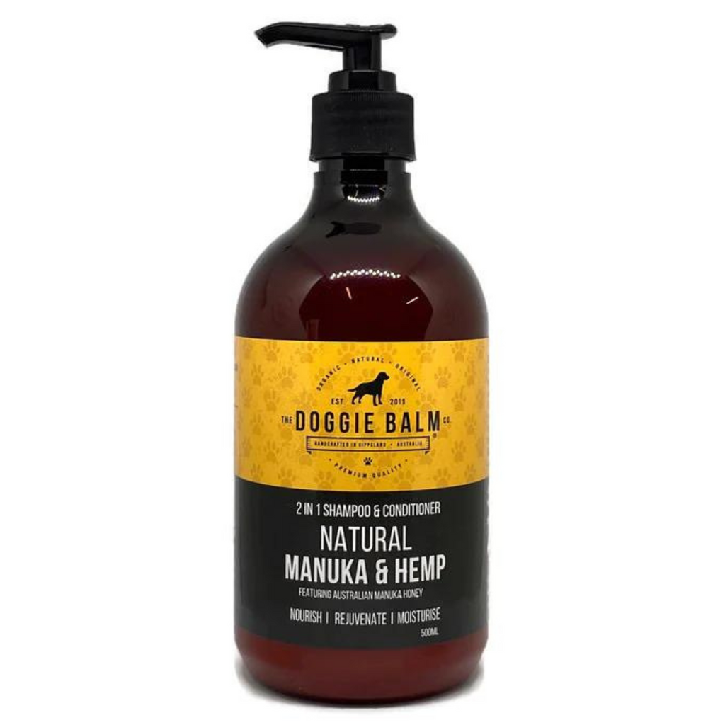 A bottle of DoggieBalm 2in1 Natural Manuka & Hemp Shampoo and Conditioner with a pump dispenser, featuring product information and branding.